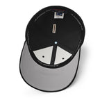 Interior view of the black MAKE NO MISTAKES. cap, showing the stretch band, panel seams and silver underside of the curved visor.