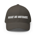 Front view of the dark grey MAKE NO MISTAKES. cap with white embroidered lettering and a curved visor.