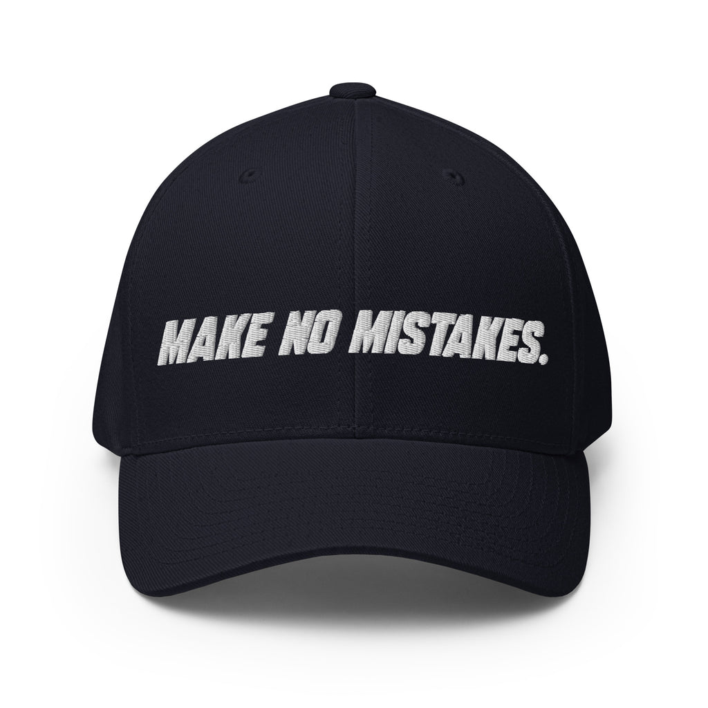 Front view of the dark navy MAKE NO MISTAKES. cap with white embroidered lettering and a curved visor.