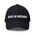 Front view of the dark navy MAKE NO MISTAKES. cap with white embroidered lettering and a curved visor.