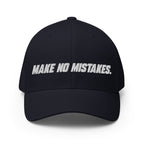 Front view of the dark navy MAKE NO MISTAKES. cap with white embroidered lettering and a curved visor.
