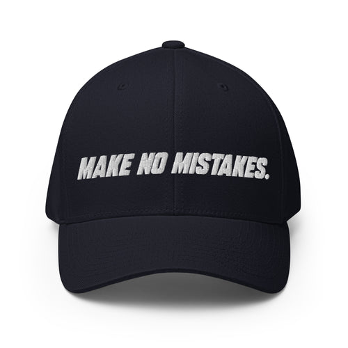 Front view of the dark navy MAKE NO MISTAKES. cap with white embroidered lettering and a curved visor.