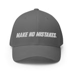 Front view of the grey MAKE NO MISTAKES. cap with white embroidered lettering and a curved visor.