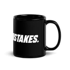 Black 11 oz MAKE NO MISTAKES. ceramic mug viewed with the curved handle on the right, showing its glossy finish and white wraparound print.