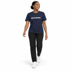 Full-body model wearing the navy MAKE NO MISTAKES. T-shirt with white chest print, walking with a relaxed arm swing and looking to the side on a white background.