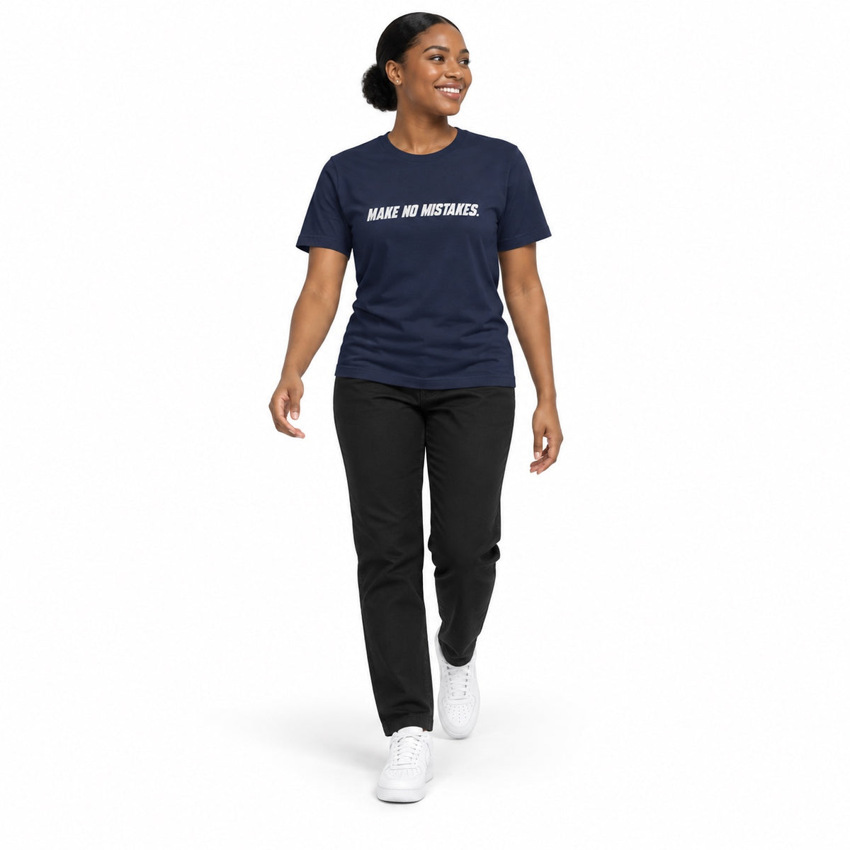 Full-body model wearing the navy MAKE NO MISTAKES. T-shirt with white chest print, walking with a relaxed arm swing and looking to the side on a white background.