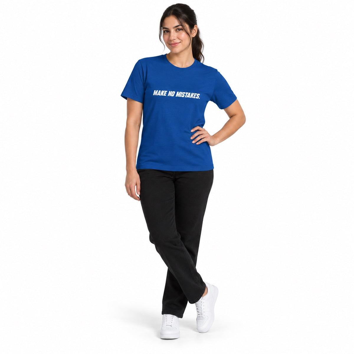 Full-body model wearing the true royal MAKE NO MISTAKES. T-shirt with white chest print, standing with crossed ankles and one hand on her hip on a white background.