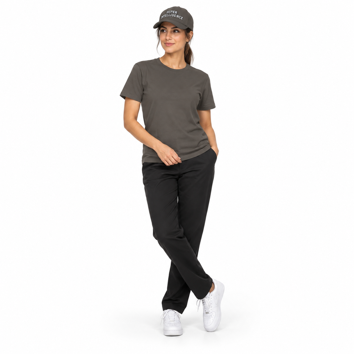 Full-body model wearing the dark grey Super Intelligence cap with a matching dark grey T-shirt, black trousers and white trainers on a plain white background.