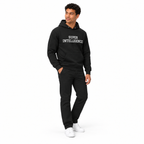 Full-body model wearing the black Super Intelligence hoodie with the front graphic visible, standing at an angle and looking aside on a plain white background.