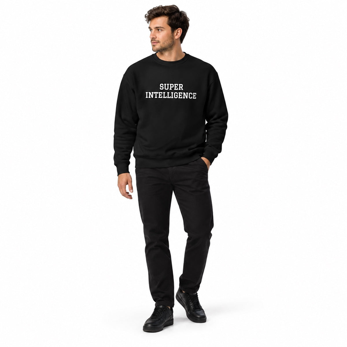 Full-body model wearing the black Super Intelligence sweatshirt with a two-line chest print and black shoes, one hand in his pocket and looking left on white.