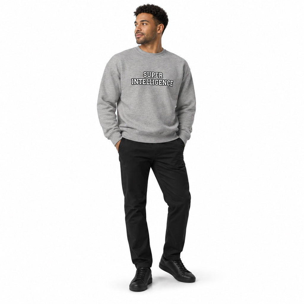 Full-body model wearing the carbon grey Super Intelligence sweatshirt with a two-line chest print, black trousers and shoes, hands in pockets on a white background.