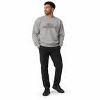 Full-body model wearing the carbon grey Super Intelligence sweatshirt with a two-line chest print, black trousers and shoes, hands in pockets on a white background.