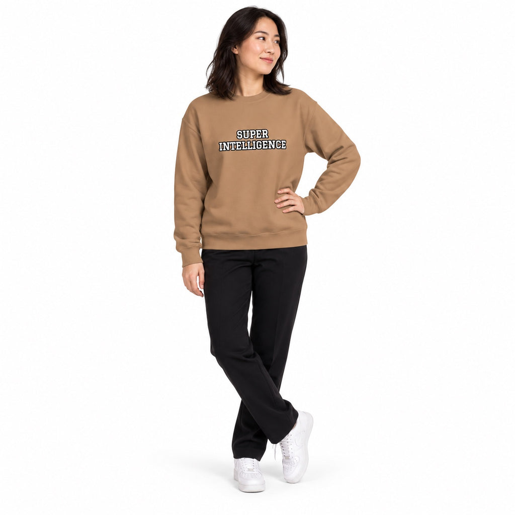 Full-body model wearing the latte beige Super Intelligence sweatshirt with a two-line chest print, one hand on her hip and ankles crossed on a white background.